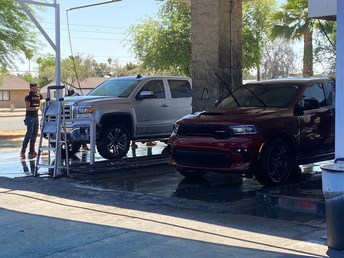 Detailing two trucks under the canopy